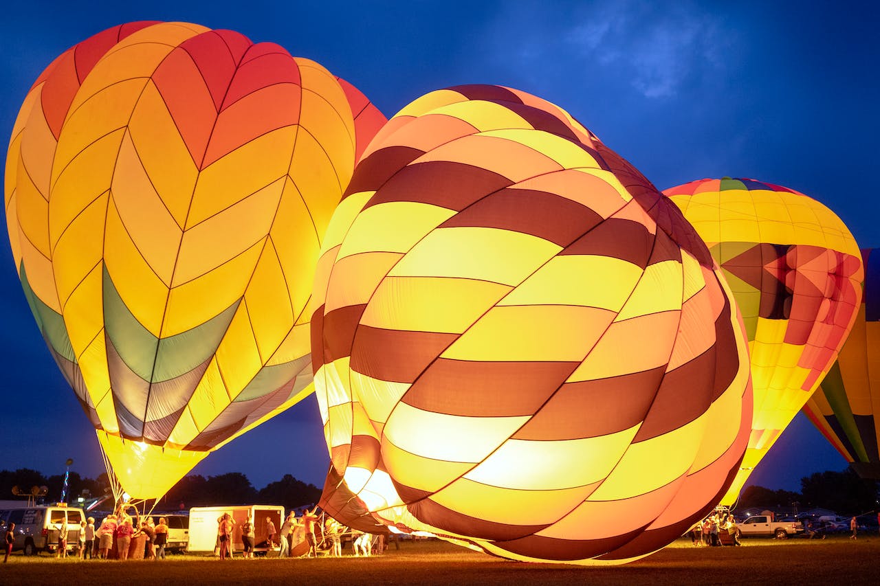 Group of people preparing to fly two air balloons